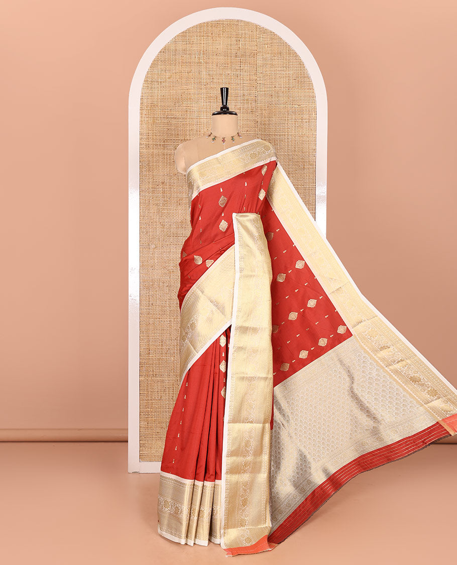Red Soft Silk Saree Decked Up with Antique Zari Buttas, Complemented with a Contrast Traditional Zari Design Steeped Border, Adorned with Intricate Pallu, and a Contrast Blouse