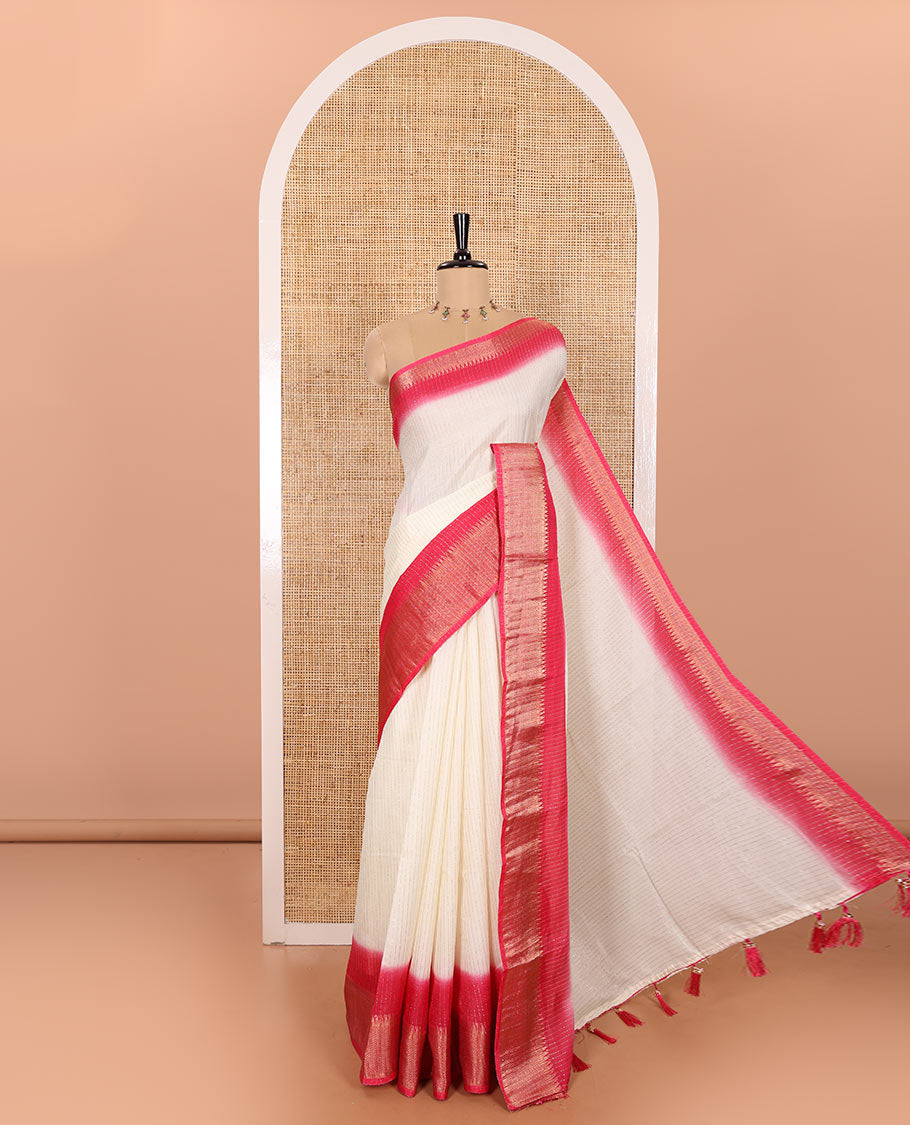 Half-White Dola Silk Saree Adorned with Vertical Golden Stripes Running All Over Its Body, Complemented by a Contrast Traditional Zari Design Woven Border, Subtly Striped Pallu, and a Contrast Buttas Woven Blouse