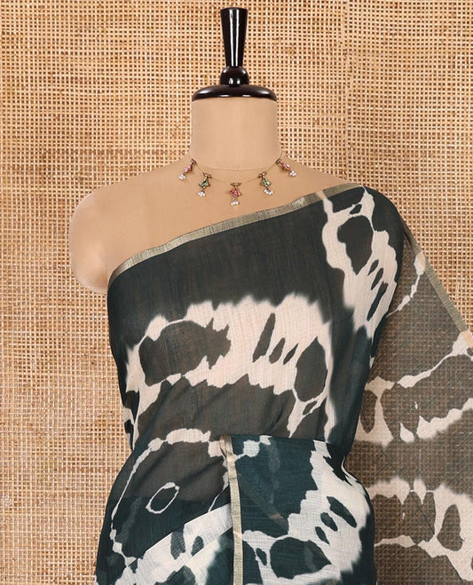 Borderless Green Linen Cotton Saree Accentuated with Shibori Prints, Complemented by Contrast Pallu Steeped with Floral Vine Print, and Paired with a Contrast Floral Printed Blouse