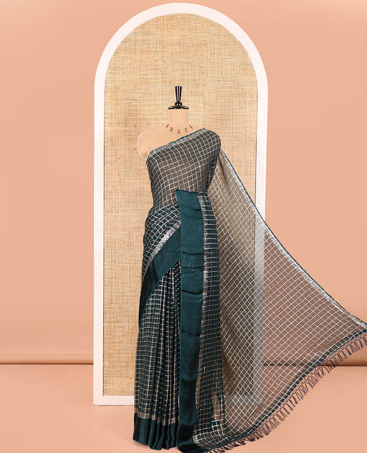 Peacock Green Viscose Georgette Saree Gleamed with Golden Zari Checks All Over Its Body, Adorned with a Satin Plain Border, a Self Pallu Featuring the Same Checks, and Paired with a Running Blouse
