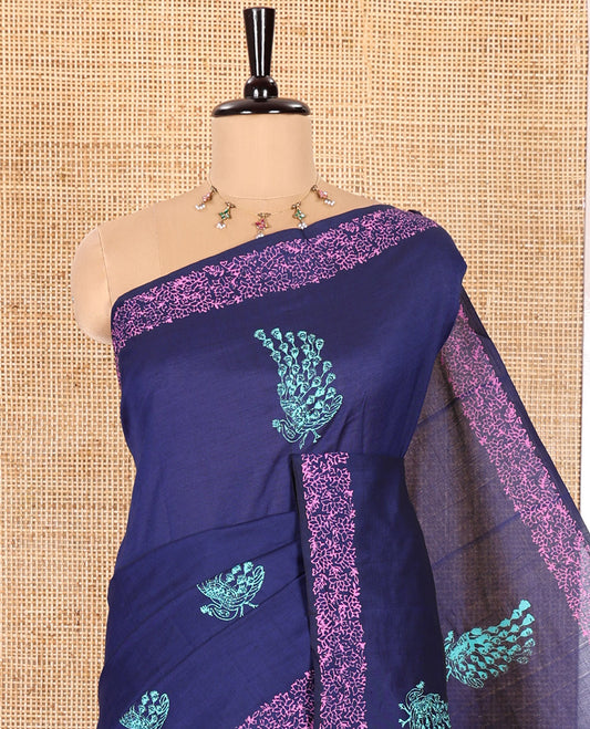 Blue South Cotton Saree Featuring Pretty Peacock Paisley Motifs Block Printed All Over Its Body, Subtly Floral Printed Border, and Comes with One Matching Blouse, and One Contrast Patola Printed Blouse