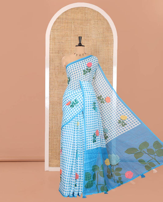 Borderless blue linen Cotton Saree, Graced with Rose Floral Buttas and Checked Design on Its Body, Pallu Pictures a Beautiful Rose Floral Motifs, and Paired with a Matching Blouse