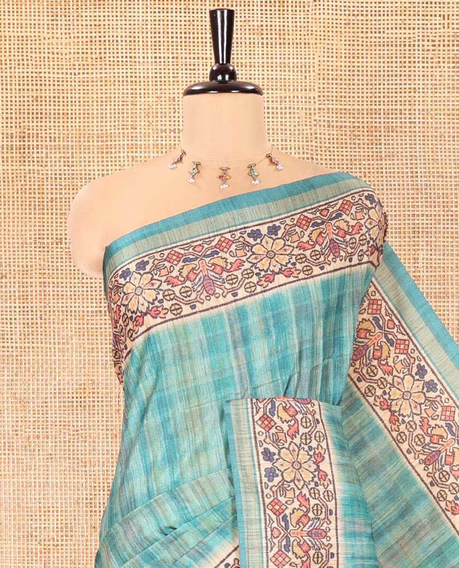 Rama Katan Silk Saree, Embellished with Checked Design On Its Body, Artfully Designed Madhubani Painting Theme Border, Pallu of Same Madhubani Print, and Paired with a Madhubani Printed Blouse