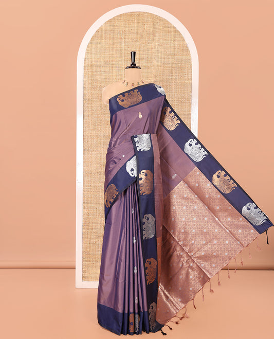 Lavender Soft Silk Saree, Elevated With Zari Buttas All Over Its Body, Complemented by Captivating Contrast Border of Elephant Motifs, Grandly Decked Up Pallu, and Paired with a Contrast Blouse