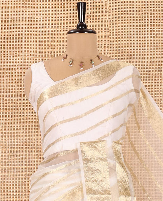 Cream Semi-Organza Saree, Steeped in Richness of Horizontal Zari Stripes All Over Its Body, Highlighted by a Traditional Zari Design Border, Gleaming Zari Design Pallu, and Paired with a Matching Blouse