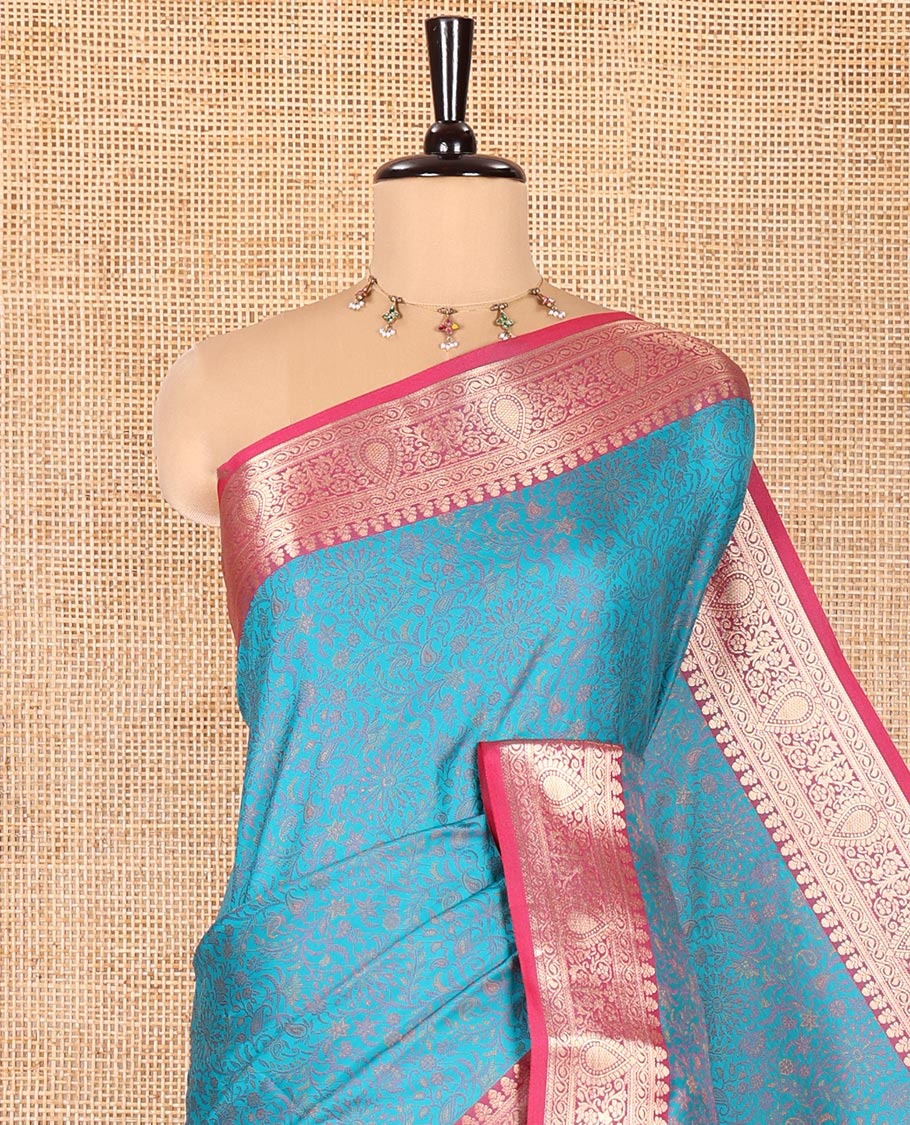 Rama Elite Soft Silk Saree, Subtly Sparkled with Floral-Paisley Designs On Its Body, Complemented by Contrast Traditional Zari Designs Woven Border, Intricately Designed Pallu, and Paired with a Matching Blouse