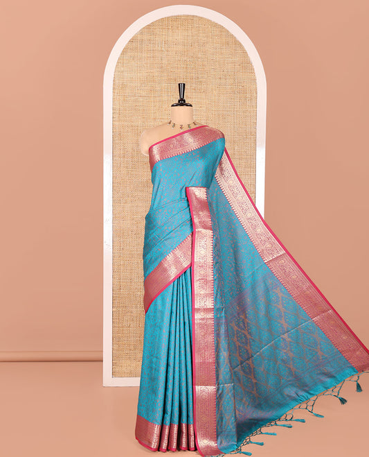 Rama Elite Soft Silk Saree, Subtly Sparkled with Floral-Paisley Designs On Its Body, Complemented by Contrast Traditional Zari Designs Woven Border, Intricately Designed Pallu, and Paired with a Matching Blouse