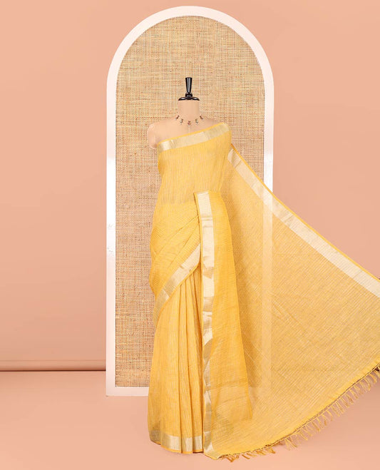 Yellow Linen Zari Cotton Saree, Gleamed Up with Zari Stripes All Over Its Body, a Subtle Zari Border, a Self-Pallu, and Comes Without a Blouse