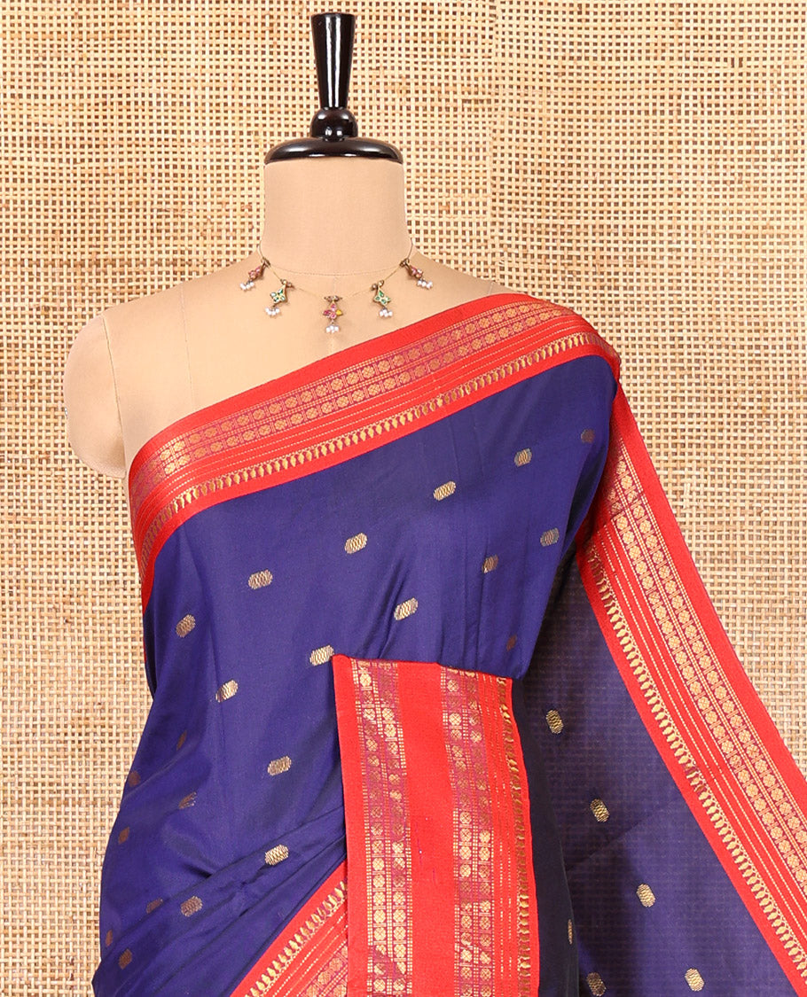 Dark Blue Softy Silk Saree, Delicately Woven With Zari Buttas All Over Its Body, Complemented by Contrast Traditional Zari Varisai Pettu Border, Grand Pallu, and Paired with a Contrast Blouse