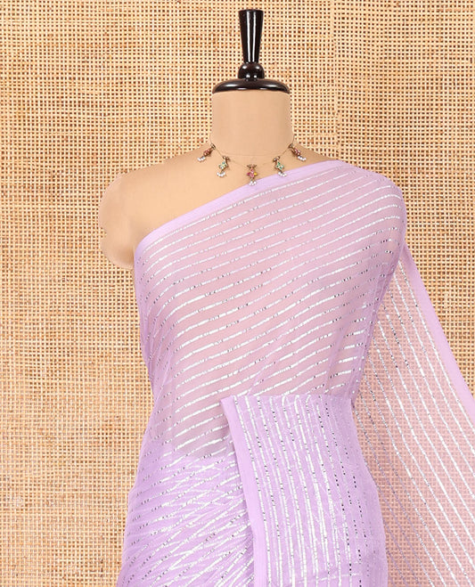 Borderless Lavender Chiffon Saree, Gleamed Up with Horizontal Stripes on Its Body, a Self-Pallu, and Has No Blouse