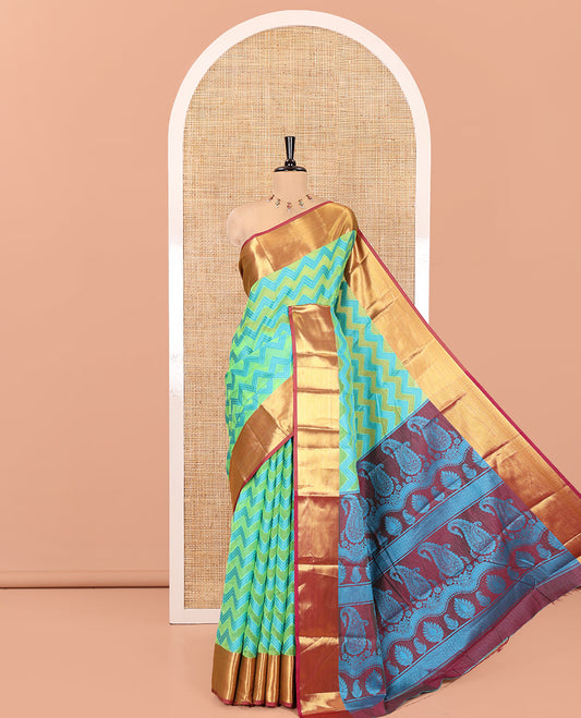 Parrot Green Semi-Organza Saree Features Pochampally Ikat Chevron Stripes, a Contrast Border, Paisley Pallu, and Contrast Blouse