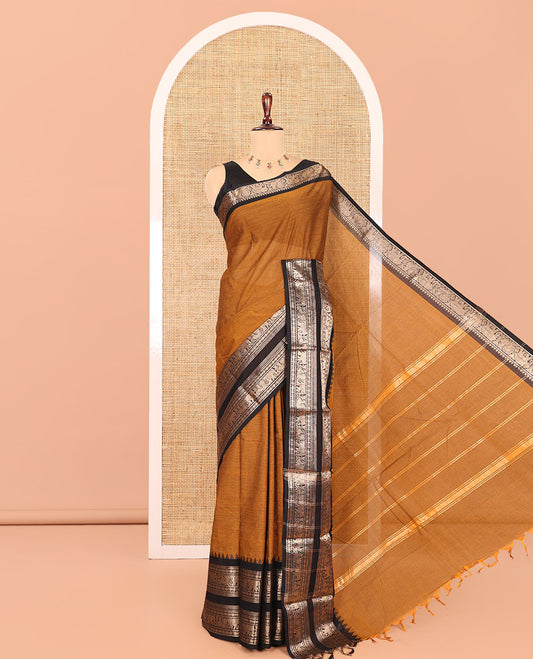Mustard Plain Chettinad Cotton Saree, Complemented by Contrast Peacock-Elephant Temple Border, Striped Pallu, and a Matching Blouse