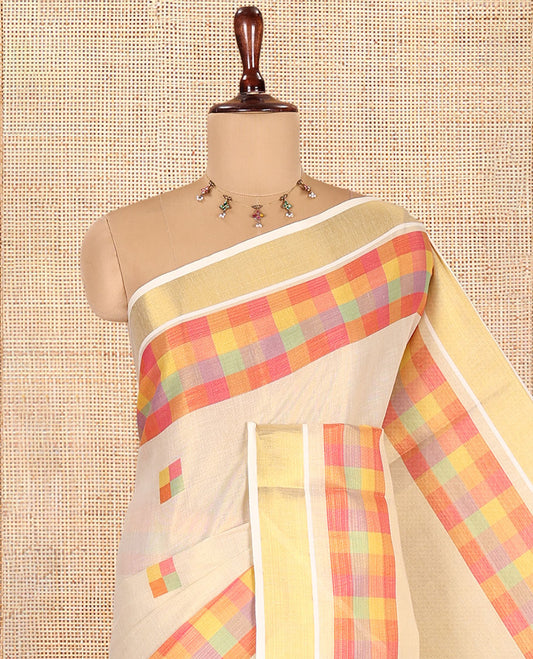 Gold-Pink Kerala Tissue Cotton Saree Features Madras Checked Buttas, a Zari Checked Border, and a Contrast Blouse