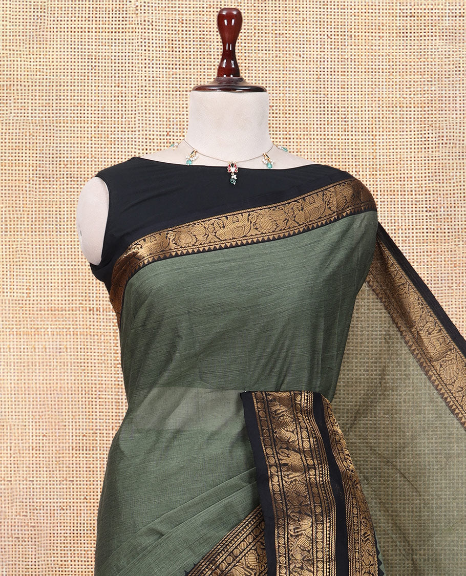 Green Plain Chettinad Cotton Saree, Complemented by a Contrast Rettai Pettu Elephant-Peacock Temple Border, a Matching Blouse