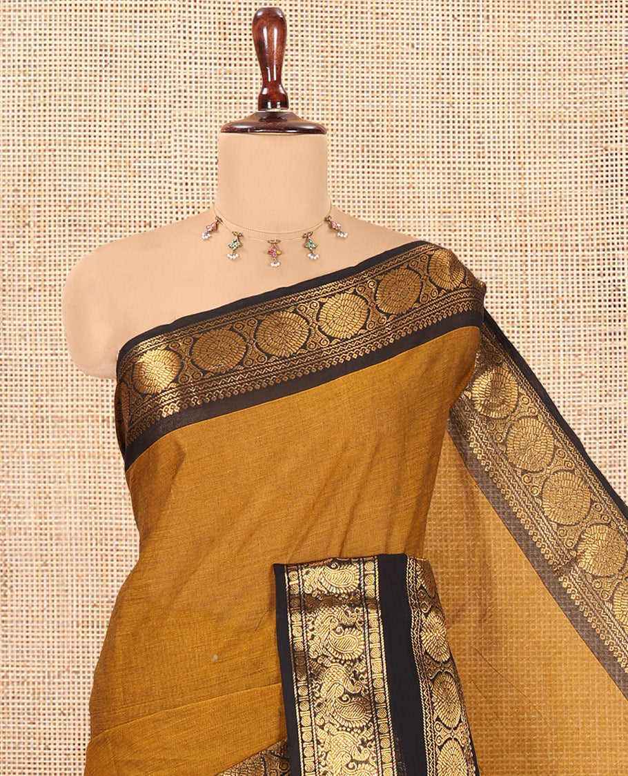 Mustard Plain Chettinad Cotton Saree, Complemented by a Contrast Peacock-Chakram Rettai Pettu Border, and a Matching Blouse