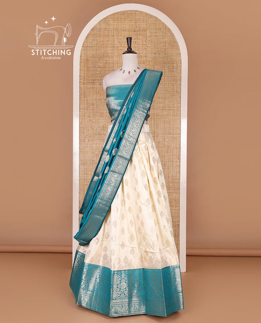 Cream with rama green semi-banarasi half-saree, zari buttas with contrast traditional zari border skirt, zari jacquard blouse, and zari design dhavani