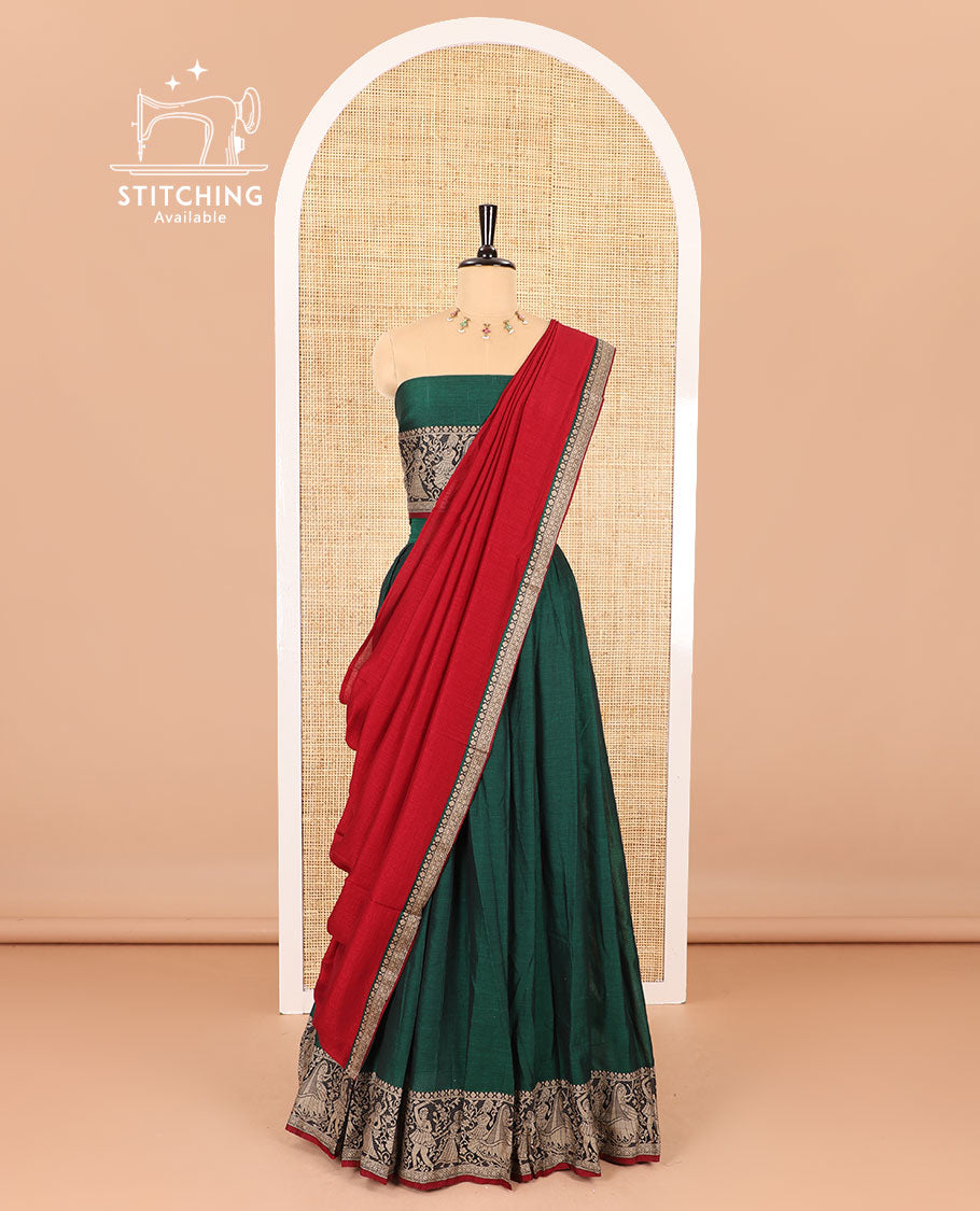 Green half-saree, plain with contrast human dancing motifs woven bordered skirt, matching blouse , and a contrast thin bordered dhavani