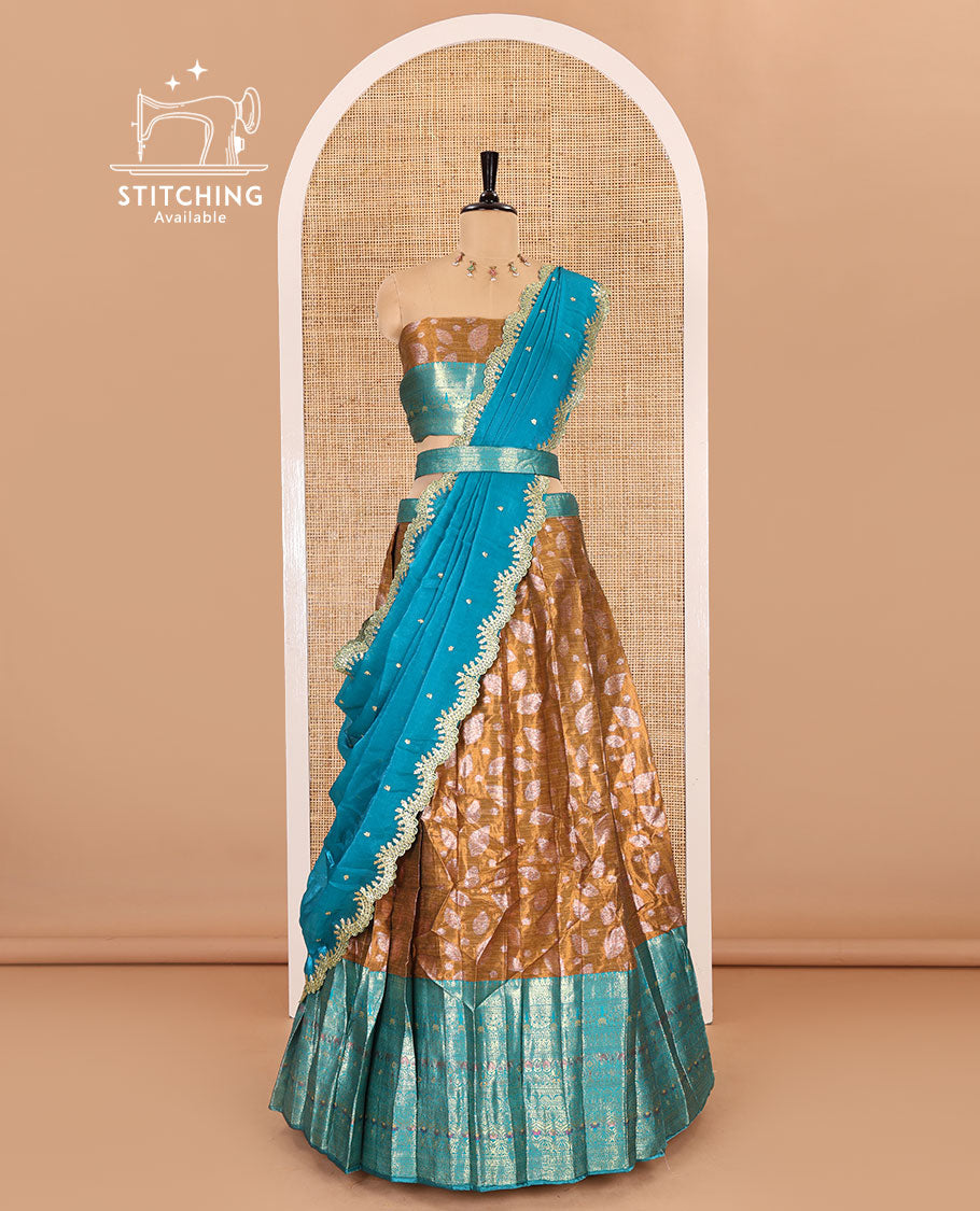 Mustard and rama color half-saree, leaf jacquard with contrast traditional bordered banarasi tissue skirt, a matching blouse, and a contrast scallop embroidered fendi organza dhavani