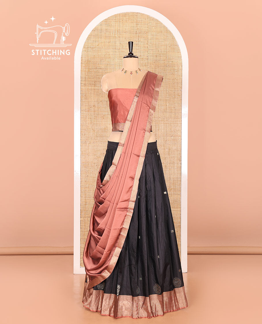 Black and rust half-saree with buttas with contrast traditional bordered taffeta silk skirt, a matching blouse, and a contrast bordered syska georgette dhavani