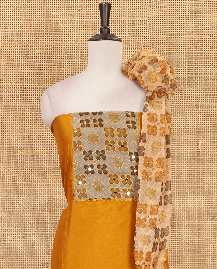 Mustard Vichitra silk material chudidar set, brasso print & mirror embroidered neck work top, santoon bottom & four-petal floral motifs printed dupatta