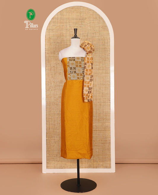 Mustard Vichitra silk material chudidar set, brasso print & mirror embroidered neck work top, santoon bottom & four-petal floral motifs printed dupatta
