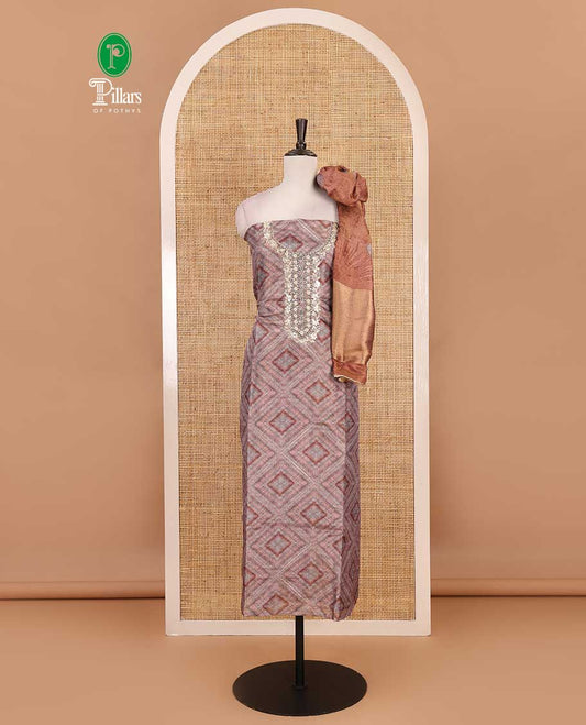 Grey and rust material chudidar set, geometric digital printed with neck embroidered Shimmer tissue top, santoon bottom, and floral printed Shimmer tissue dupatta