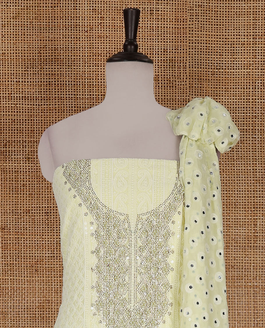 Lime yellow material churidar set, stone work with Schiffli style embroidered georgette top, American Crape bottom, and polka dotted printed mirror work dupatta
