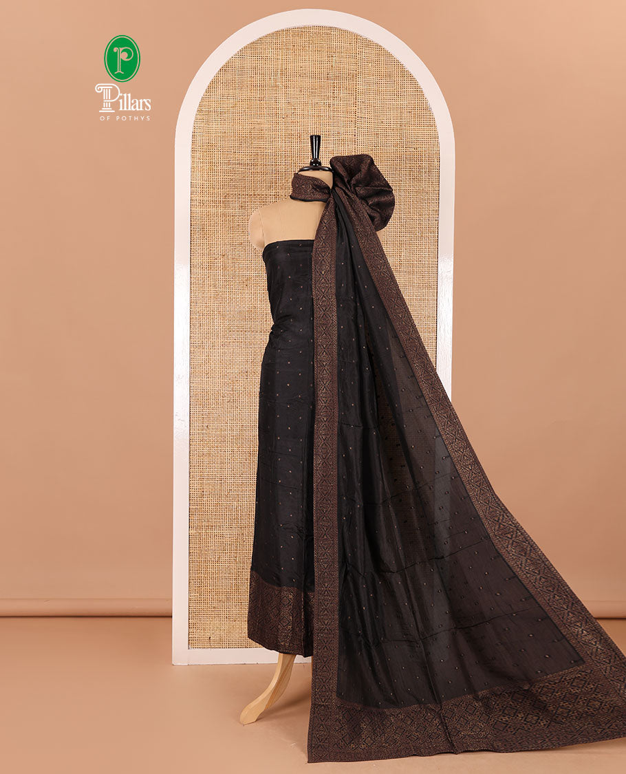 Black material chudidar set, copper zari buttas and jaal design semi-modal silk top, plain santoon bottom, and zari design woven semi-modal silk dupatta