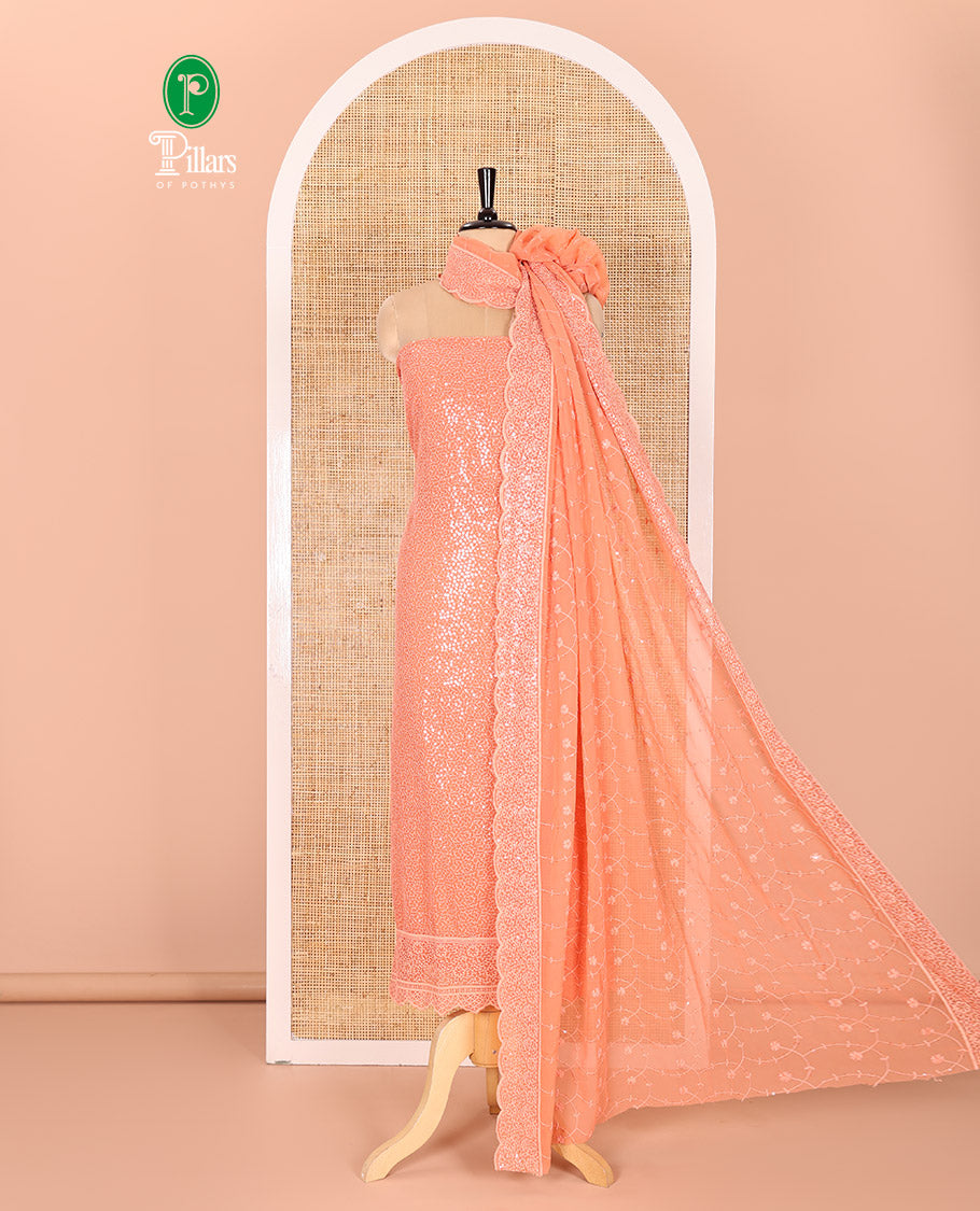 Peach Material Chudidar Set Features Sequin Embroidered Georgette Top, a Plain American Crepe Bottom, and a Scallop Dupatta Embellished with Floral Vine Embroidery