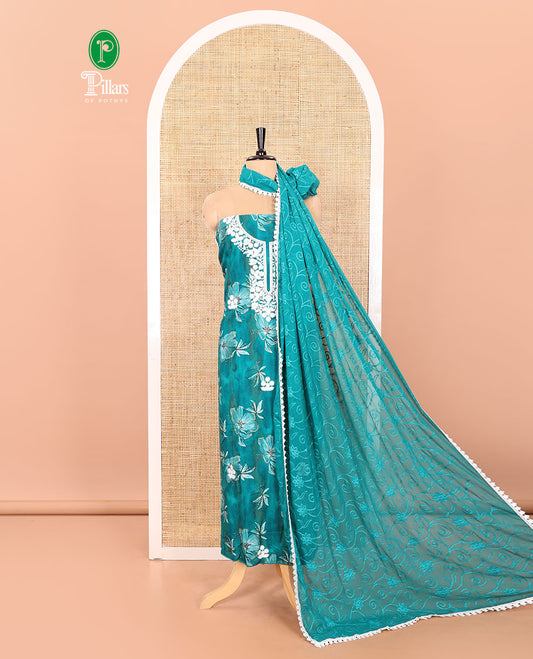 Rama Material Chudidar Set Accentuated with Phulkari-Style Floral Embroidery and Floral Print Rayon Top, Subtly Made Plain Rayon Bottom, and a Chiffon Georgette Dupatta of Floral Theme Designs