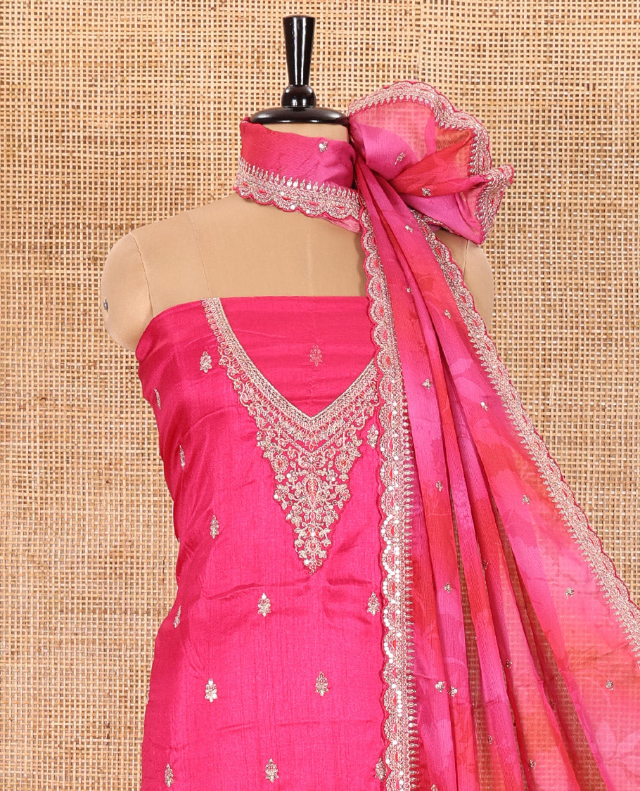 Rani Pink Material Chudidar Set Decked Up with Intricately Embroidered Muga Silk Top, Subtly Made Plain Santoon Bottom, and a Bemberg Chiffon Dupatta Featuring Floral Printed, and Embroidery