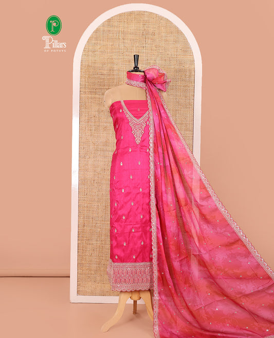 Rani Pink Material Chudidar Set Decked Up with Intricately Embroidered Muga Silk Top, Subtly Made Plain Santoon Bottom, and a Bemberg Chiffon Dupatta Featuring Floral Printed, and Embroidery