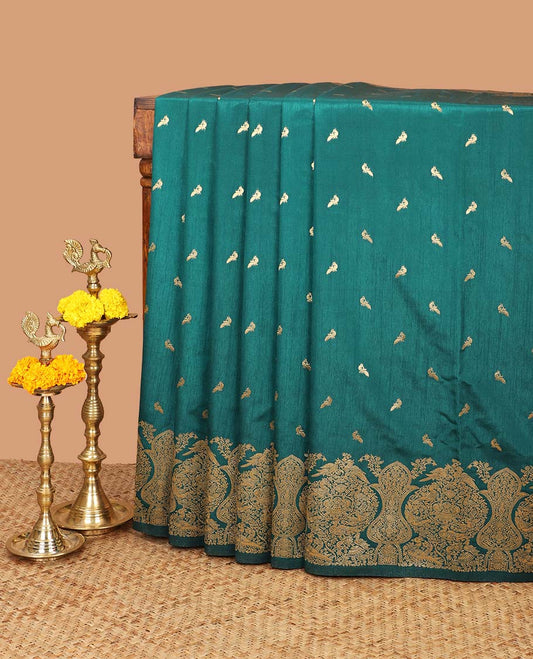 Bottle green zari peacock butta dola raw silk saree with kancheepuram zari border with geometrical zari pallu along with plain blouse