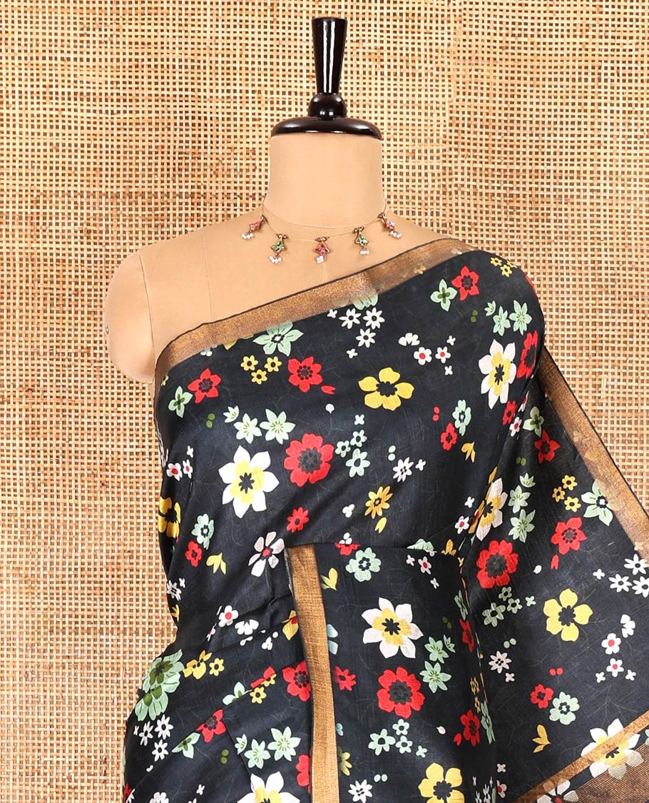 Black colorful floral printed banana pith saree, piping zari border, zari decked pallu, and a contrast floral printed blouse