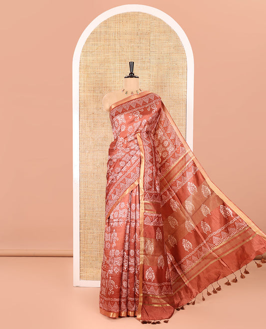 Rust Banana Pith Saree Embellished with Floral-Intricately Motifs Discharge Print All Over Its Body, Zari Bavanji Border, Pallu Subtly Woven in Intricate Print and Zari Weave, and Paired with a Matching Blouse