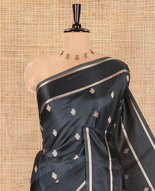 Black Semi-Banaras Satin Silk Saree, Decked Up with Zari Buttas All Over Its Body, Highlighted by Zari Striped Border, Grand Jaal Pallu, and Paired with a Matching Blouse