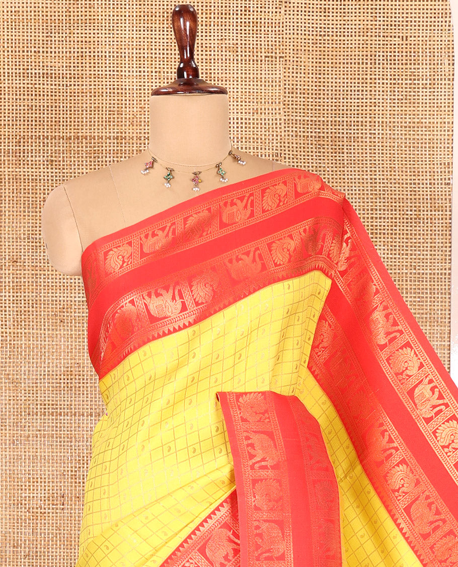 Yellow Litchi Saree, Detailed with Paisley Butta Enclosed Checks, Complemented by a Contrast Rettai Pettu Peacock-Elephant Border, a Contrast Blouse