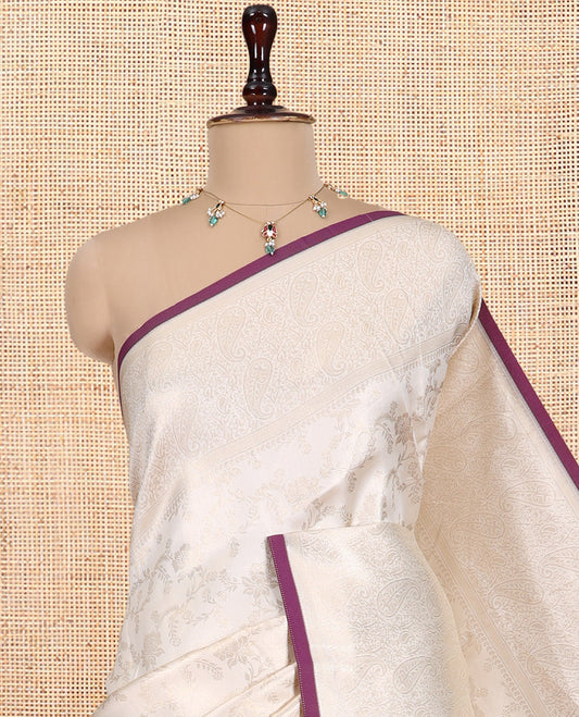Off-White-Purple Semi-Silk Saree, Adorned with Floral Jacquard Design, a Zari Paisley Border, and a Contrast Blouse