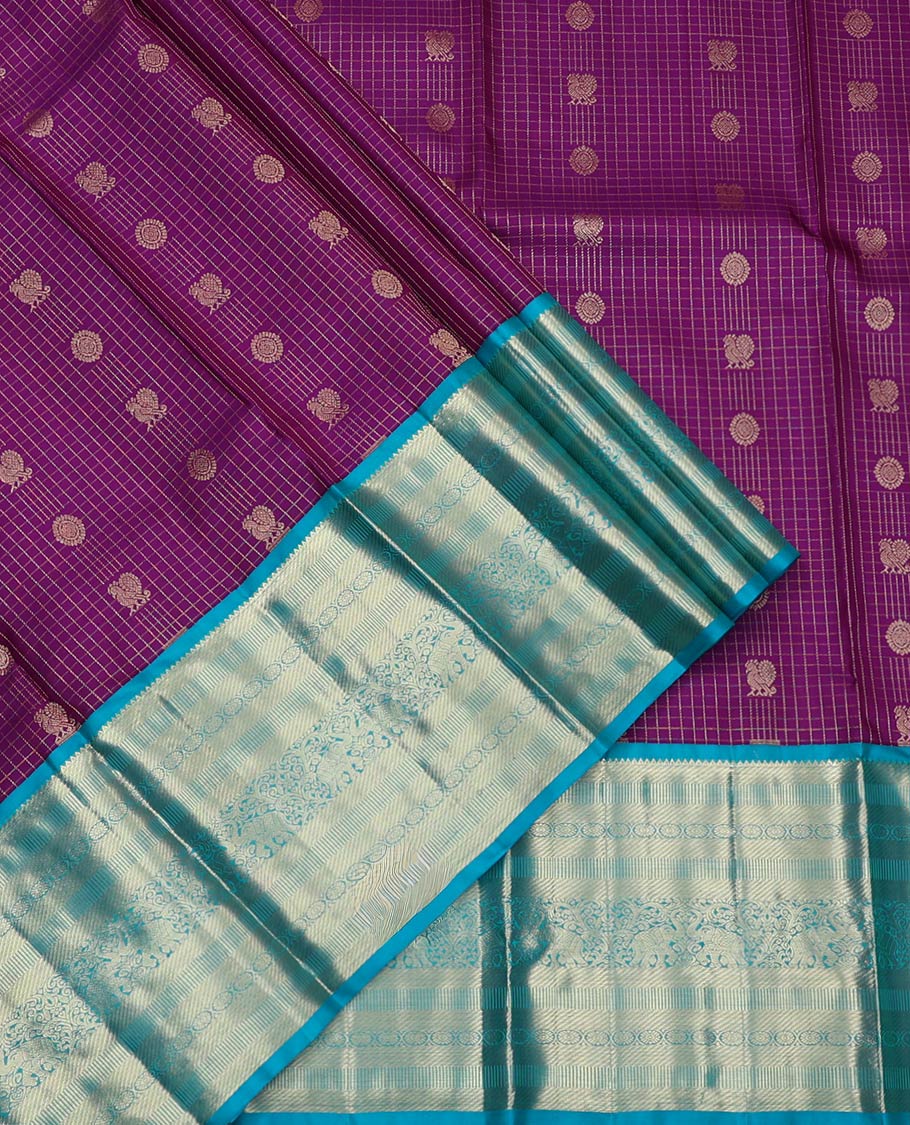 Purple Pure Silk Half-Saree, Masterfully Woven with Mayil-Chakram Buttas and Micro-Checks on Its Skirt, Complemented by a Contrast Border of Rekku, Chakram, and Yaanai Designs, Comes with a Contrast Blouse and a Dhavani of Intricate Designs