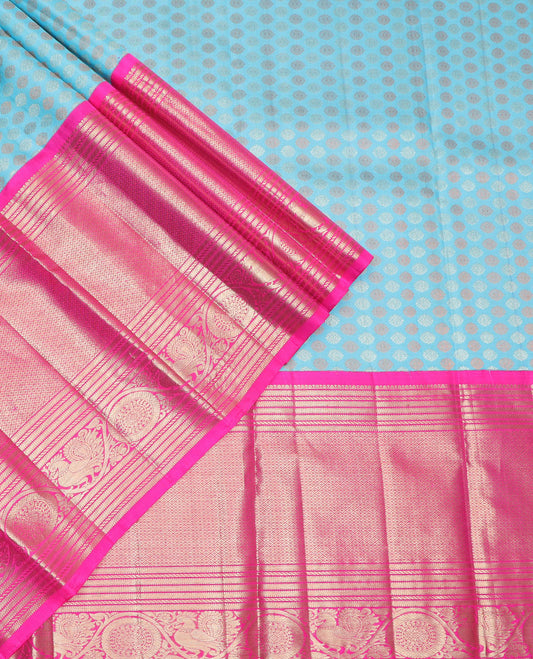 Blue buttas silk half saree with contrast border of intricate zari design, zari design blouse & floral design dhavani
