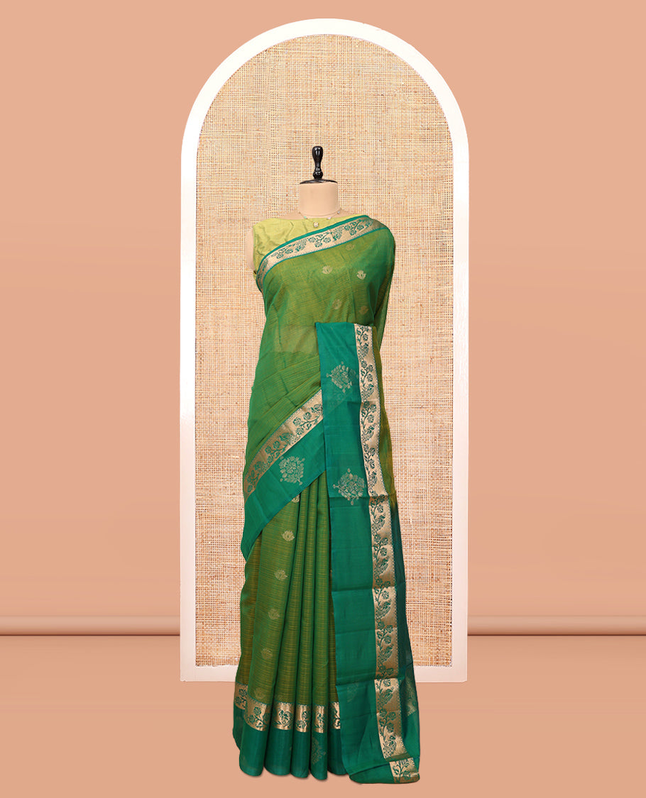 Green Silk Cotton Saree, Ornamented with Zari Buttas, a Contrast Floral Creeper Border, Jaal Pallu, and a Contrast Blouse