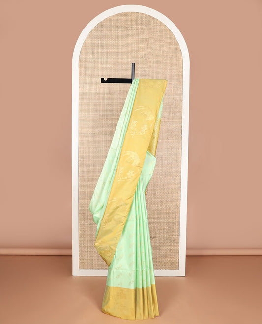 Mint green leaf buttas soft silk saree with contrast floral design border & floral jaal design pallu