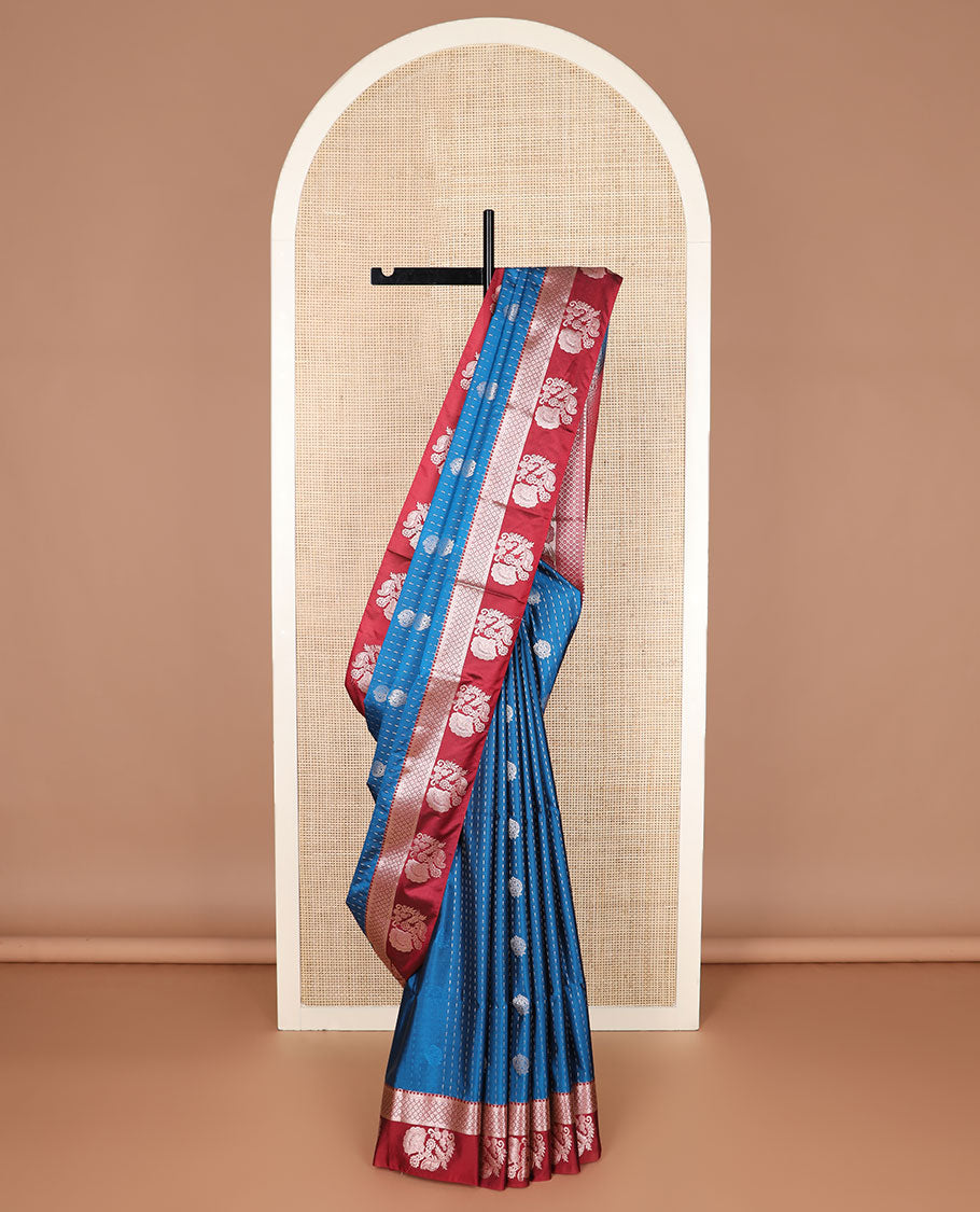 Blue zari buttas soft silk saree, contrast traditional design zari border, and pallu of traditional designs