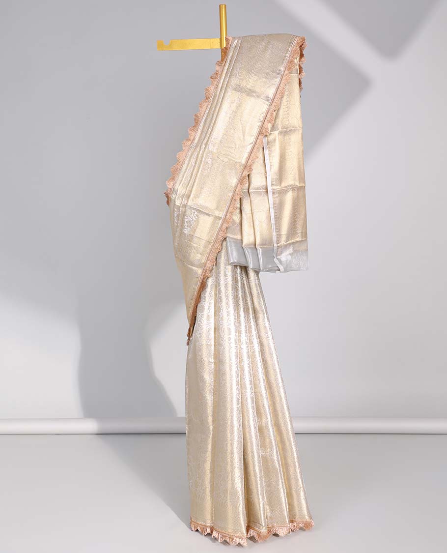 Cream floral jacqaurd tissue saree with self zari design & intricate zari design pallu