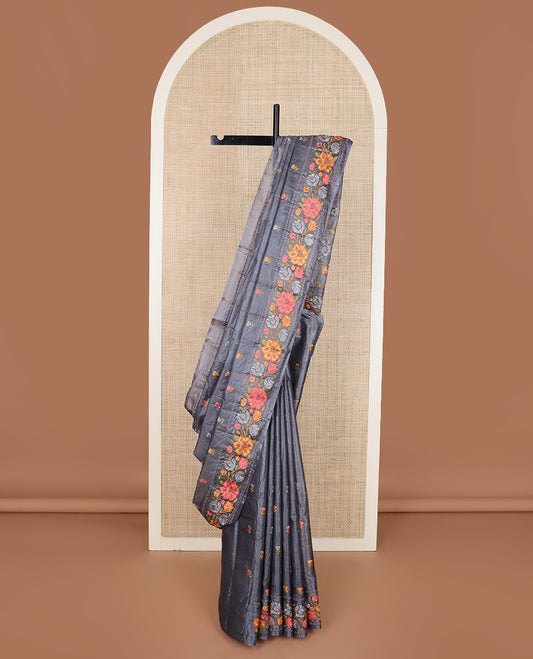 Cement grey floral motifs, multi-color thread embroidered tussar saree, floral vine thread embroidered border, and pallu