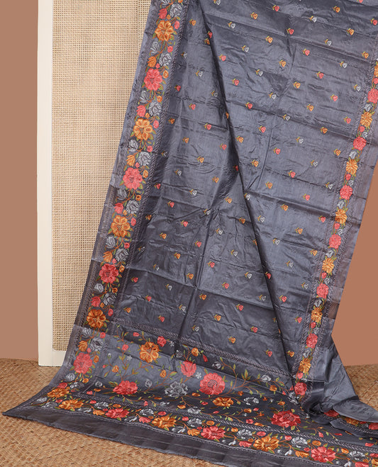 Cement grey floral motifs, multi-color thread embroidered tussar saree, floral vine thread embroidered border, and pallu