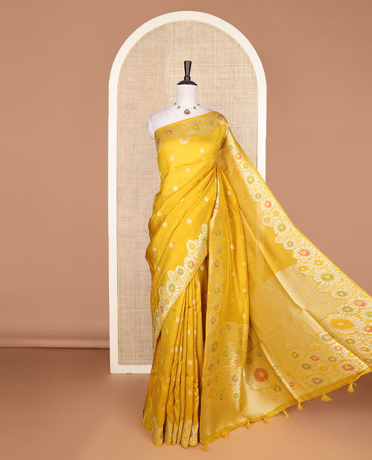 Yellow flower buttas Matka silk saree, scallop floral meenakari zari woven border, and pallu of stripes, and floral meenakari designs