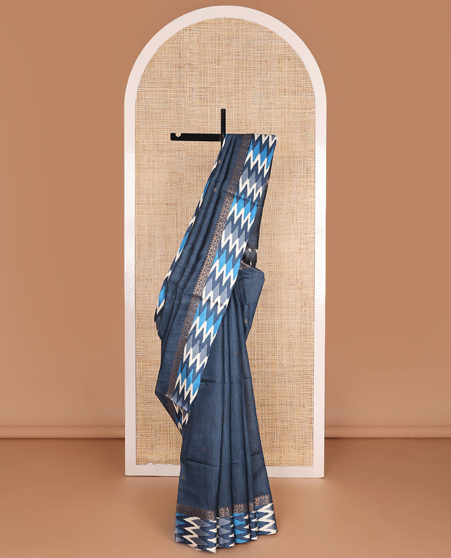 Blue tussar saree with buttas, contrast pochampally ikkat-style geometric patterned border & pallu