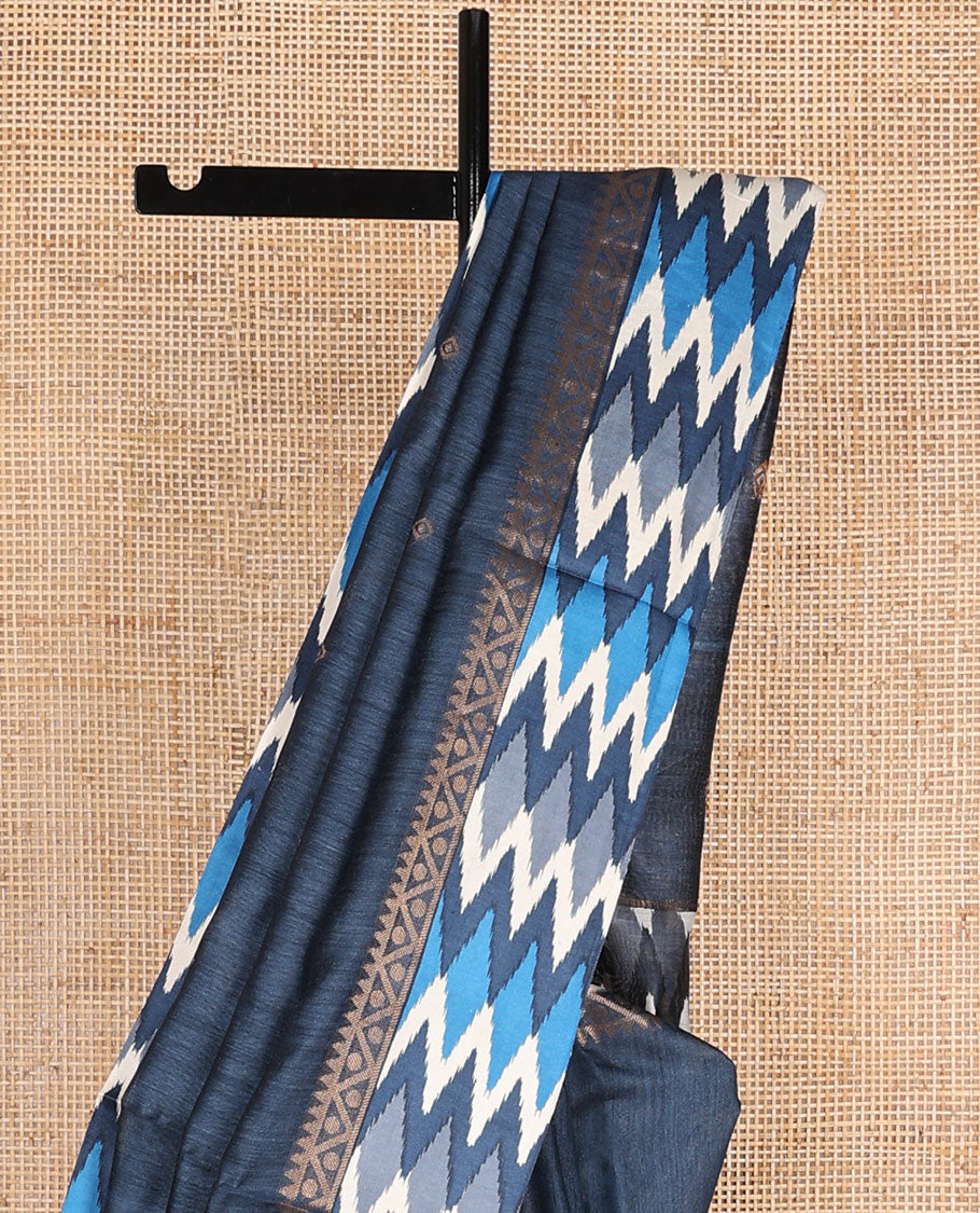 Blue tussar saree with buttas, contrast pochampally ikkat-style geometric patterned border & pallu