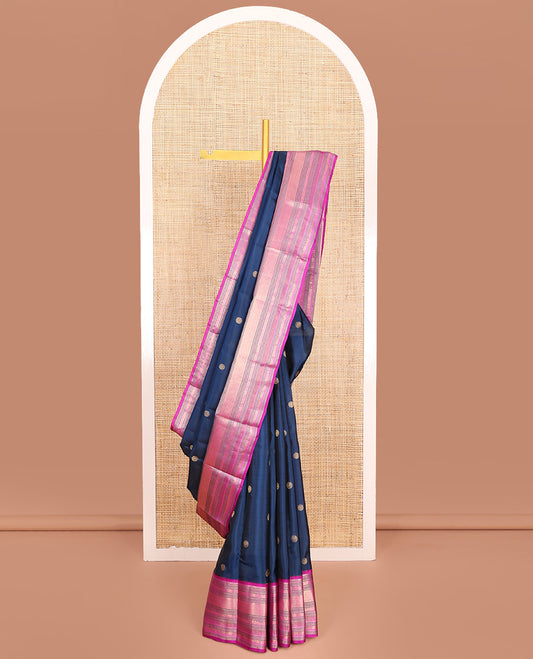 Blue Vasundhara Lite-Silk Mix Saree, Elevated with Chakram Zari Buttas All Over Its Body, Complemented by a Contrast Border of Thilakam Mokku, Banaras, Mayil, Yaanai, and Mayil Kann Designs, Grand Pallu of Jaal Designs, and Paired with a Contrast Blouse